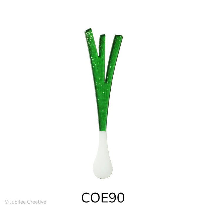image of a fusible precut glass green onion. it has a translucent green top with a white onion on the bottom - COE90