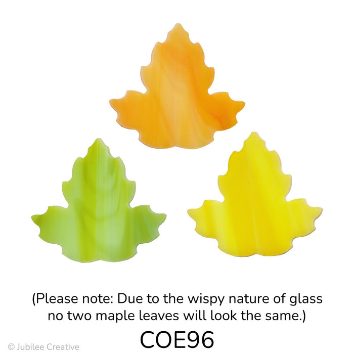 Image shows three glass maple leaves in mixed shades of yellow, orange, and green with wispy, marbled patterns. Each leaf has a three-pointed shape with a soft, organic flow.