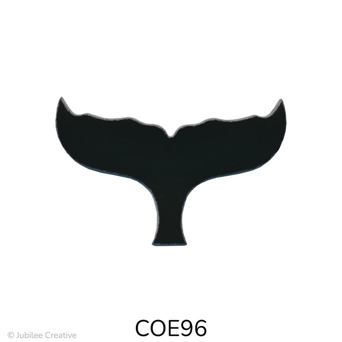image of a COE96 fusible black glass whale tail.