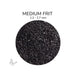 Close-up of Bullseye Black Opalescent 000100 Medium Frit showing 1.2 to 2.7 mm particles.