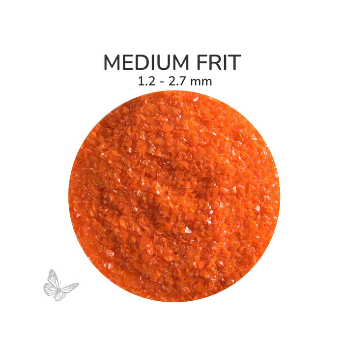 Close-up of Bullseye Orange Opalescent 000125 Medium Frit showing 1.2 to 2.7 mm particles.