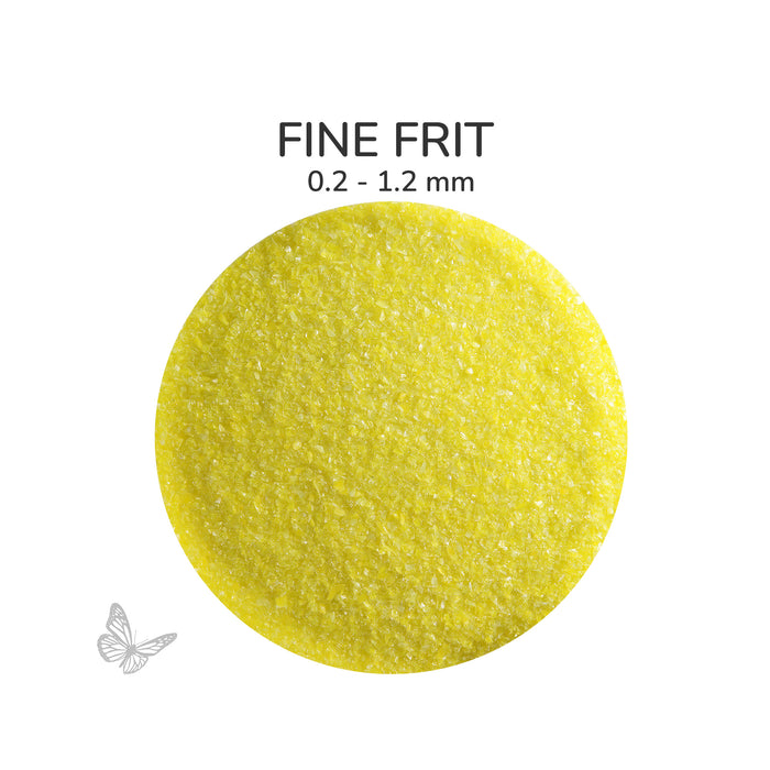 Close-up of Bullseye Canary Yellow Opalescent 000120 Fine Frit showing 0.2 to 1.2 mm particles.