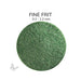 Close-up of Bullseye Forest Green Opalescent 000141 Fine Frit showing 0.2 to 1.2 mm particles.