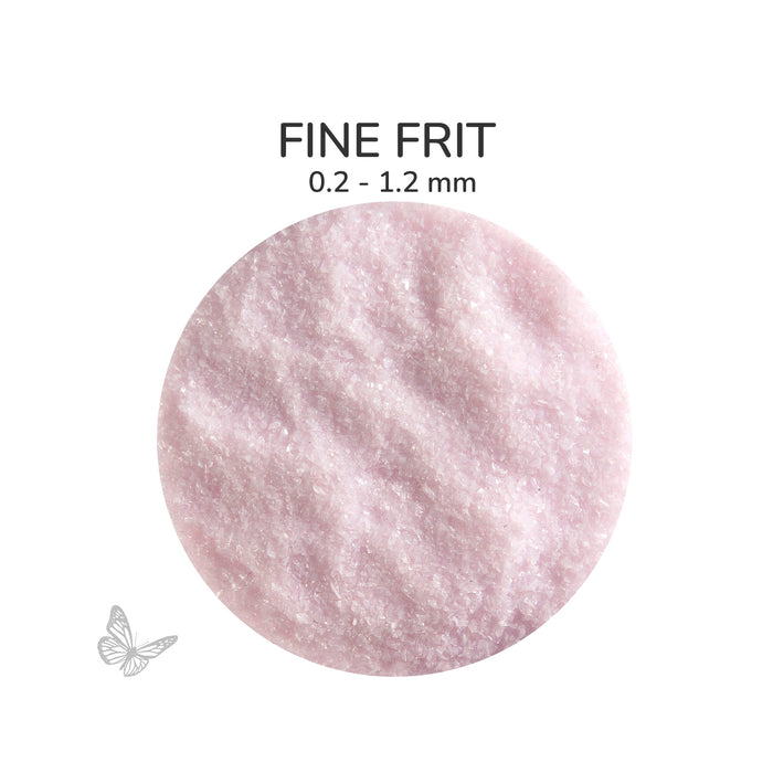 Close-up of Bullseye Petal Pink Opalescent 000421 Fine Frit showing 0.2 to 1.2 mm particles.