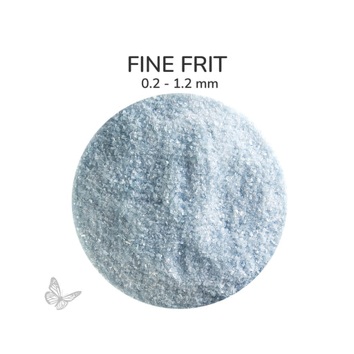 Close-up of Bullseye Powder Blue Opalescent 000108 Fine Frit showing 0.2 to 1.2 mm particles.