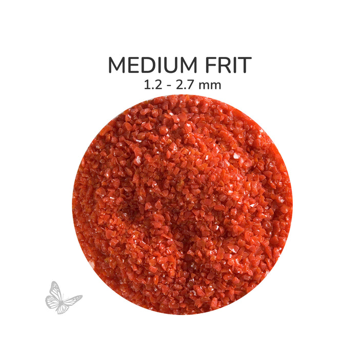 Close-up of Bullseye Red Opalescent 000124 Medium Frit showing 1.2 to 2.7 mm particles.