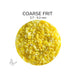 Close-up of Bullseye Sunflower Yellow Opalescent 000220 Coarse Frit showing 2.7 to 5.2 mm particles.