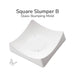 Square Slumper B ceramic glass slumping mold shown at an angle with a smooth curved surface for creating gently curved fused glass pieces.