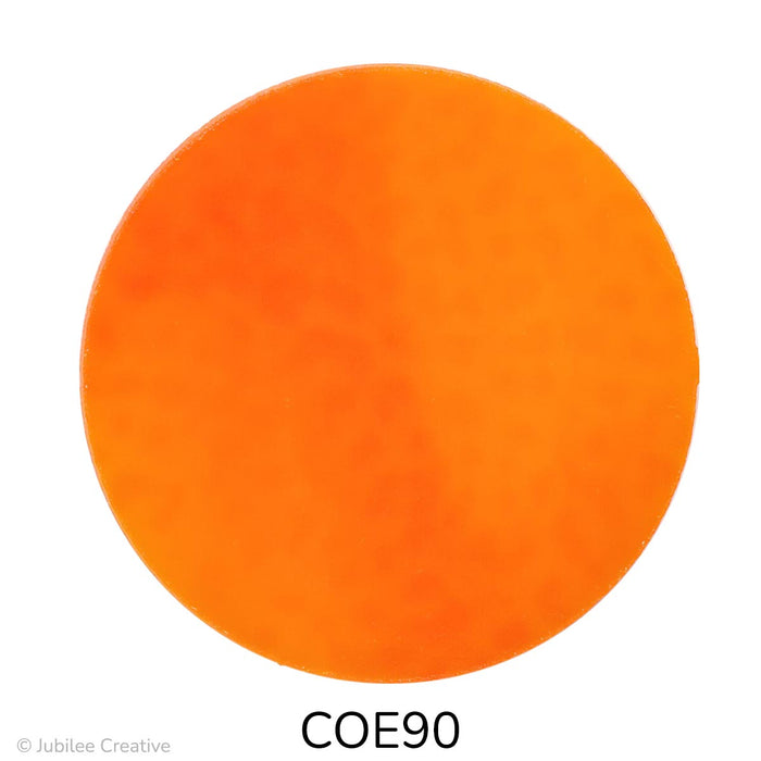 image of a fusible precut glass circle in the color opaque orange - COE90