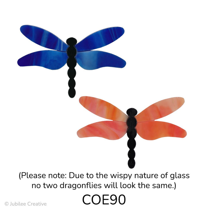 image of a two precut glass dragonflies with a black body and wings in wispy blue or wispy orange - COE90