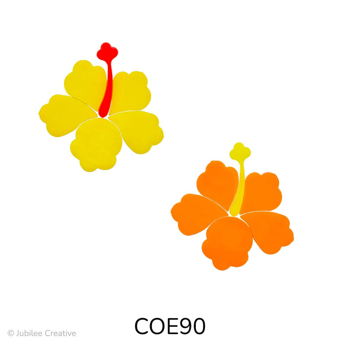 image of a two fusible precut glass hibiscus flower - one flower is yellow with a red orange stamen and the other is an orange flower with a yellow stamen - COE90