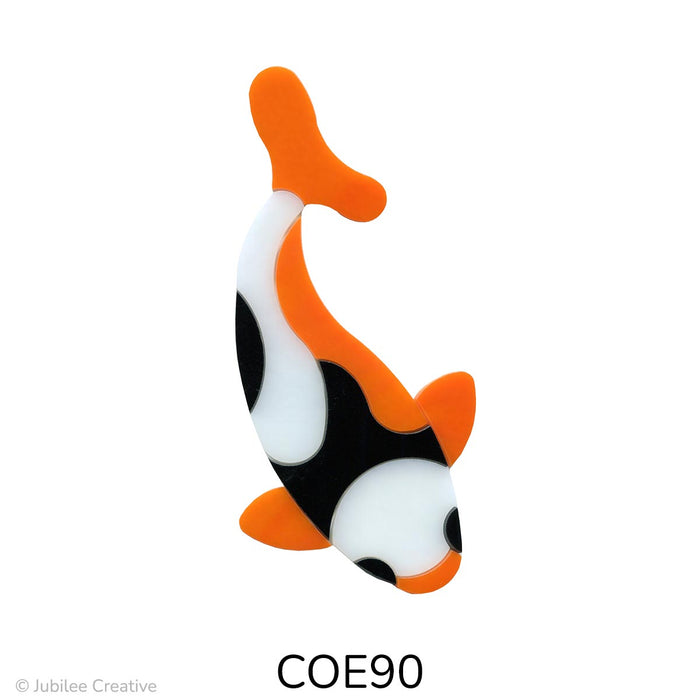 image of a fusible precut glass koi fish.  The fish is made up of eleven pieces of glass in three colors, black, white, and orange - COE90