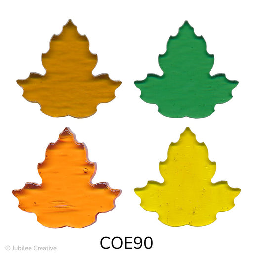 fusible precut glass maple leaves shown in four different translucent colors, amber, green, orange, and yellow - COE90