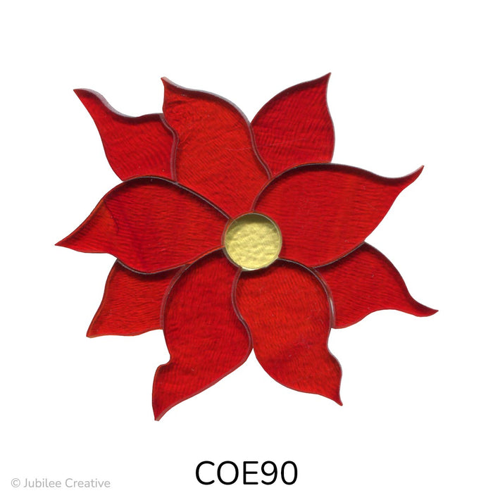 image of a fusible precut glass poinsettia that features nine red flower petals and a yellow center - COE90