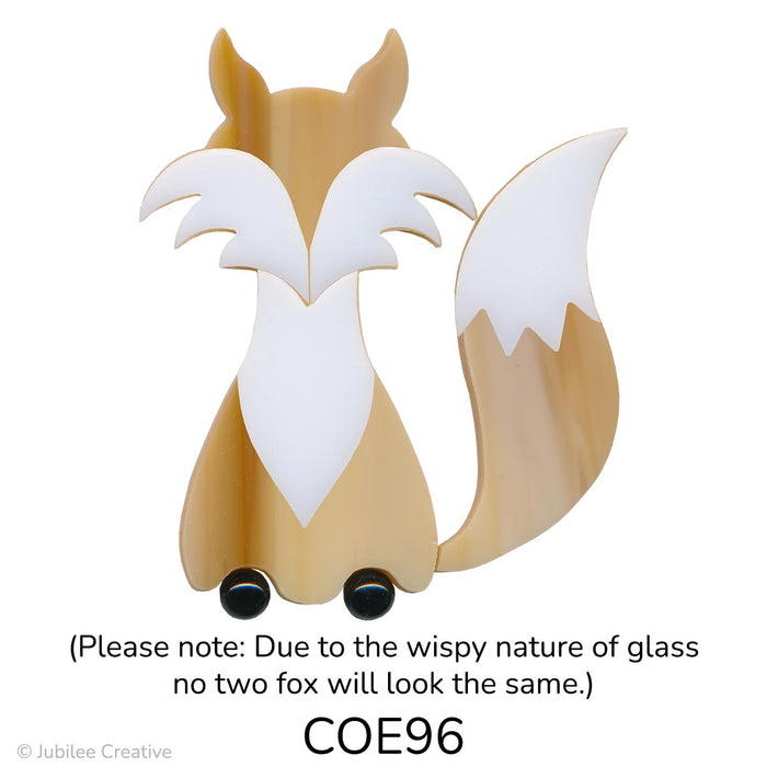 image of a fusible precut brown glass fox with white fur and two black dots for feet - COE96