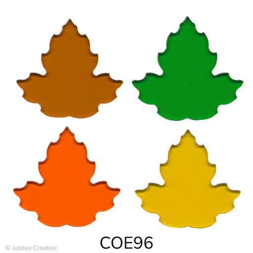 fusible precut glass maple leaves shown in four different translucent colors, amber, green, orange, and yellow - COE96