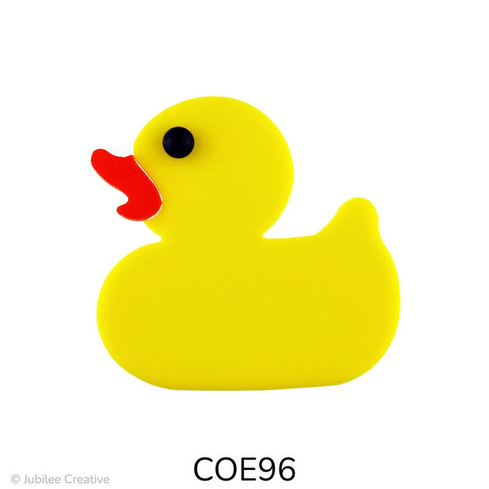 image of a fusible precut yellow glass rubber duck featuring a black eye and orange beak - COE96