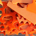 images of orange pieces of waterjet cut scrap glass -COE96