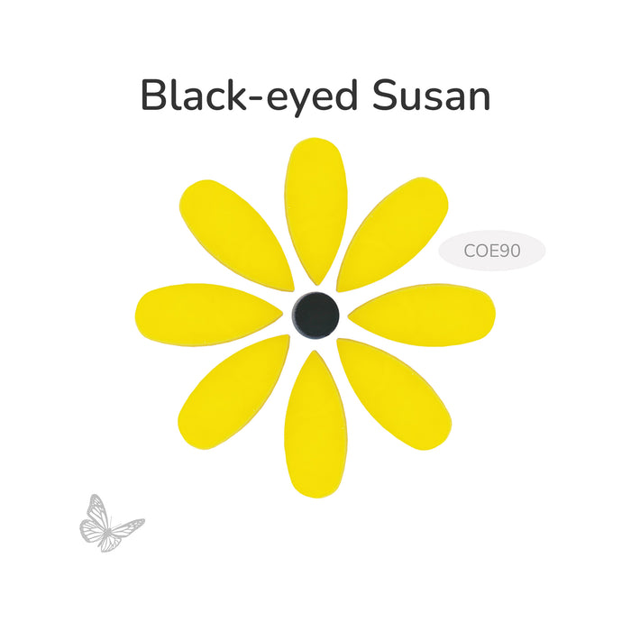 Bullseye COE90 Black-eyed Susan flower glass pieces arranged as a yellow daisy with black center on white background