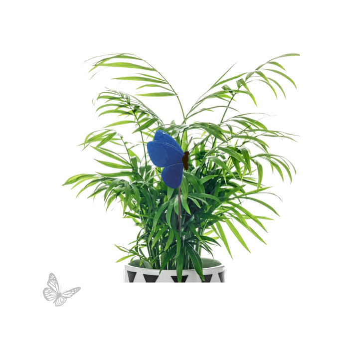 Blue butterfly glass design displayed as a plant stake in a potted plant