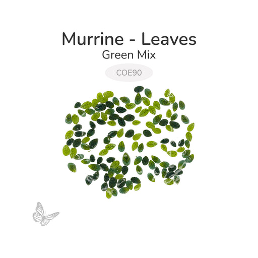 Green leaf murrine glass embellishments arranged on a white background, COE 90 compatible