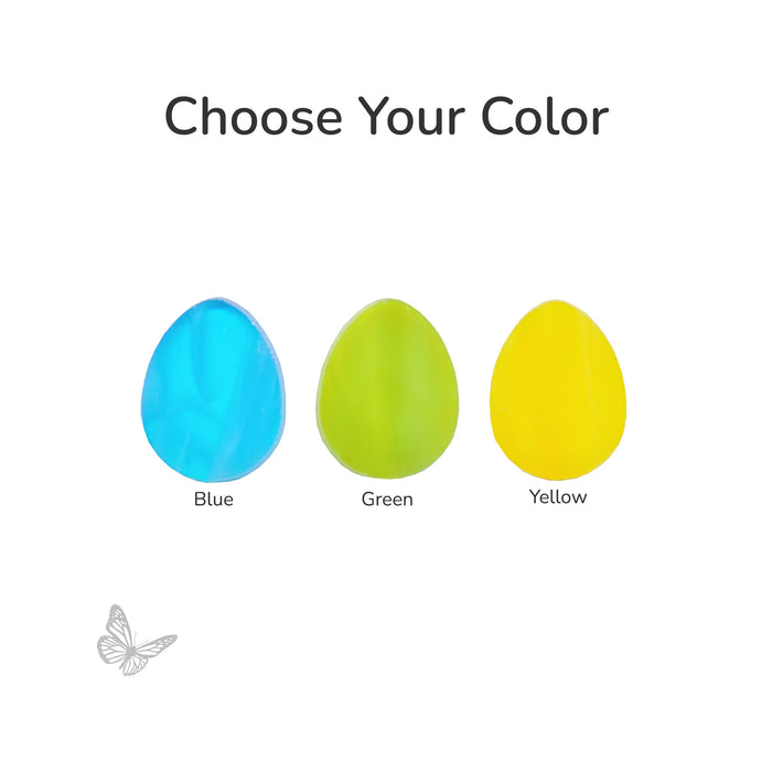 Three egg-shaped precut fusible glass pieces in blue, spring green, and canary yellow on a white background.