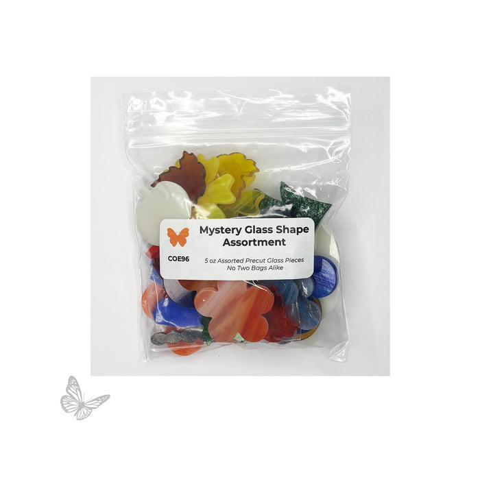 Packaged mystery glass shape assortment with colorful glass pieces and a label on a white background. COE96