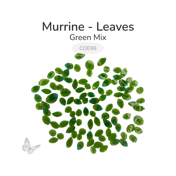 Green leaf murrine glass embellishments arranged on a white background, COE 96 compatible