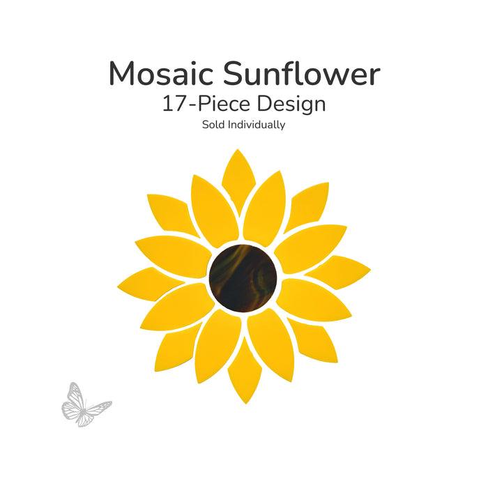 Precut mosaic sunflower design made from 17 yellow petal glass pieces and one dark center piece arranged into a sunflower pattern on a light background.